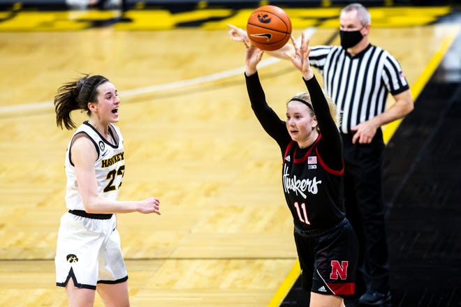 Iowa guard Caitlin Clark (22) shouts as Nebraska guard Ruby Porter (11) inbounds the ball during a NCAA Big Ten Conference women's basketball game, Saturday, March 6, 2021, at Carver-Hawkeye Arena in Iowa City, Iowa.