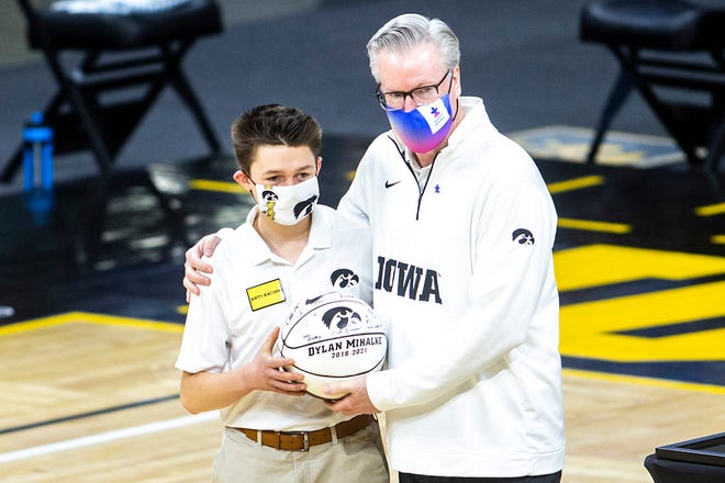 Iowa manager Dylan Mihalke poses for a photo with Iowa head coach Fran McCaffery on senior day before a NCAA Big Ten Conference men's basketball game against Wisconsin, Sunday, March 7, 2021, at Carver-Hawkeye Arena in Iowa City, Iowa.