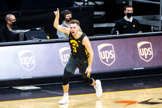 Iowa guard Jordan Bohannon (3) reacts after making a 3-point basket during a NCAA Big Ten Conference men's basketball game against Wisconsin, Sunday, March 7, 2021. As of March 20, 2021, Bohannon has scored 1,638 points in his career.