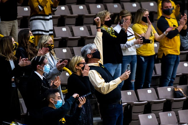 Family members of Iowa center Luka Garza react after Iowa athletic director Gary Barta (not pictured) said they plan to retire his jersey while speaking after a NCAA Big Ten Conference men's basketball game against Wisconsin, Sunday, March 7, 2021, at Carver-Hawkeye Arena in Iowa City, Iowa.