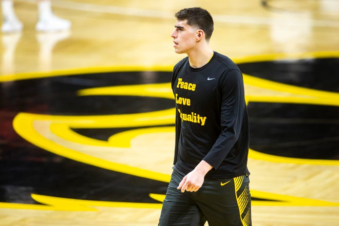 Iowa center Luka Garza warms up before a NCAA Big Ten Conference men's basketball game against Wisconsin, Sunday, March 7, 2021, at Carver-Hawkeye Arena in Iowa City, Iowa.