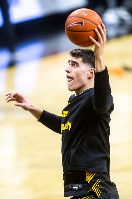 Iowa center Luka Garza warms up before a NCAA Big Ten Conference men's basketball game against Wisconsin, Sunday, March 7, 2021, at Carver-Hawkeye Arena in Iowa City, Iowa.
