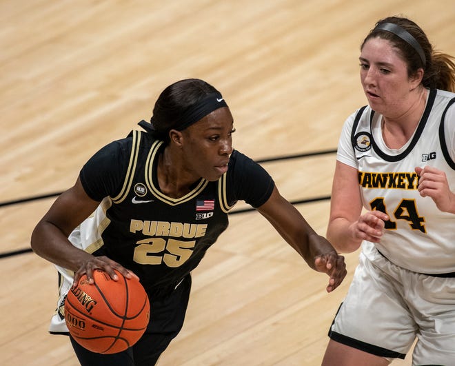 Purdue Boilermakers guard Tamara Farquhar (25) works against Iowa Hawkeyes guard McKenna Warnock (14) on Wednesday, March 10, 2021, during the women's Big Ten basketball tournament from Bankers Life Fieldhouse in Indianapolis. Iowa won 83-72.