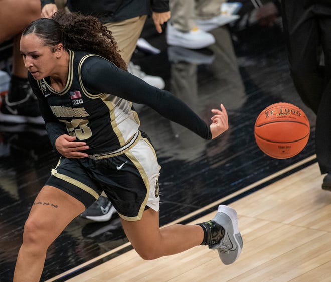 Purdue Boilermakers guard Kayana Traylor (23) hustles and saves this errant ball from going out of bounds on Wednesday, March 10, 2021, during the women's Big Ten basketball tournament from Bankers Life Fieldhouse in Indianapolis. Iowa won 83-72.