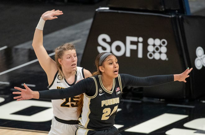 Iowa Hawkeyes forward Monika Czinano (25) defends Purdue Boilermakers center Ra Shaya Kyle (24) on Wednesday, March 10, 2021, during the women's Big Ten basketball tournament from Bankers Life Fieldhouse in Indianapolis.