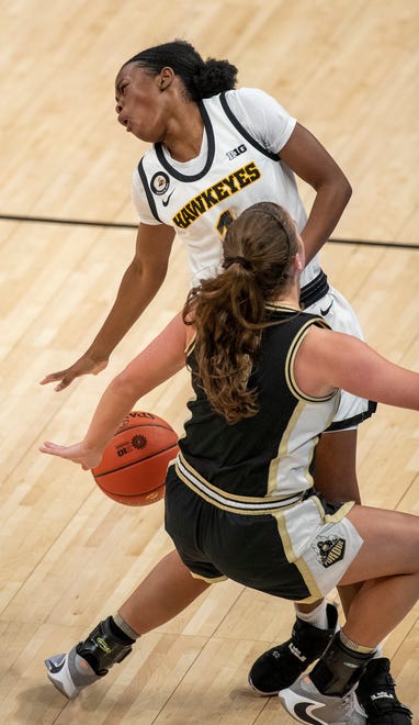 Iowa Hawkeyes guard Tomi Taiwo (1) collides with Purdue Boilermakers guard Cassidy Hardin (5) on Wednesday, March 10, 2021, during the women's Big Ten basketball tournament from Bankers Life Fieldhouse in Indianapolis.