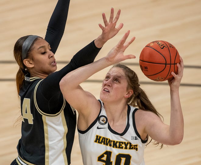 Iowa Hawkeyes center Sharon Goodman (40) puts a shot up against Purdue Boilermakers center Ra Shaya Kyle (24) on Wednesday, March 10, 2021, during the women's Big Ten basketball tournament from Bankers Life Fieldhouse in Indianapolis.