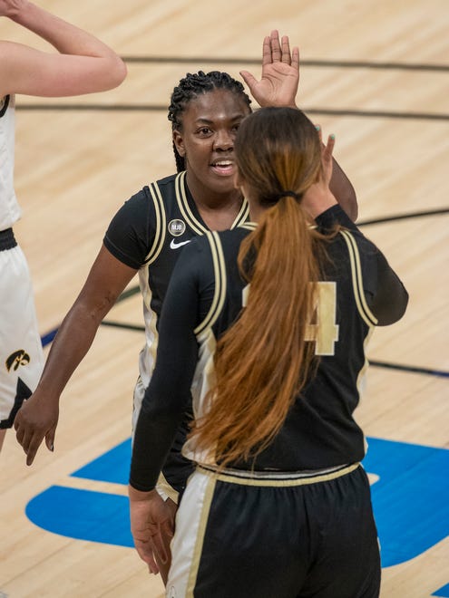 Purdue Boilermakers guard Ajah Stallings (13) celebrates a basket with teammate Ra Shaya Kyle (24) on Wednesday, March 10, 2021, during the women's Big Ten basketball tournament from Bankers Life Fieldhouse in Indianapolis. Iowa won 83-72.