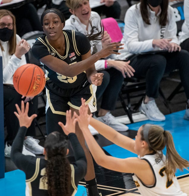 Purdue Boilermakers guard Tamara Farquhar (25) flicks a pass to a teammate during action against Iowa Hawkeyes on Wednesday, March 10, 2021, during the women's Big Ten basketball tournament from Bankers Life Fieldhouse in Indianapolis.