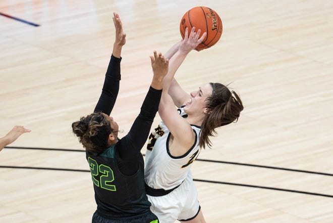 Mar 12, 2021; Indianapolis, IN, USA; Iowa Hawkeyes guard Caitlin Clark (22) shoots the ball while Michigan State Spartans guard Moira Joiner (22) defends  in the third quarter at Bankers Life Fieldhouse. Mandatory Credit: Trevor Ruszkowski-USA TODAY Sports