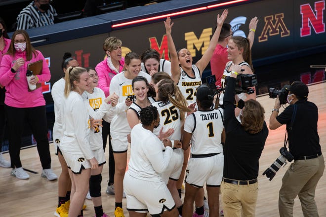 Mar 12, 2021; Indianapolis, IN, USA; The Iowa Hawkeyes celebrate the win after the game against the Michigan State Spartans at Bankers Life Fieldhouse. Mandatory Credit: Trevor Ruszkowski-USA TODAY Sports