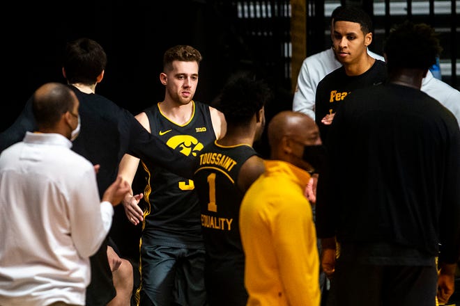 Iowa guard Jordan Bohannon (3) is introduced before a NCAA Big Ten Conference men's basketball game against Wisconsin, Sunday, March 7, 2021, at Carver-Hawkeye Arena in Iowa City, Iowa.