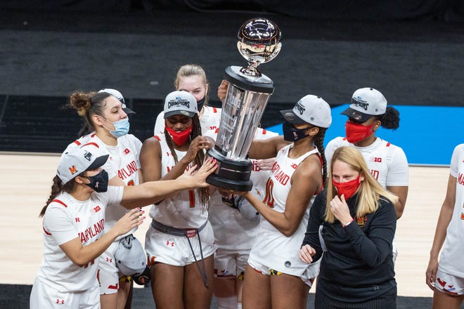 Mar 13, 2021; Indianapolis, IN, USA; The Maryland Terrapins lift the Big Ten Championship trophy after the game against the Iowa Hawkeyes at Bankers Life Fieldhouse. Mandatory Credit: Trevor Ruszkowski-USA TODAY Sports