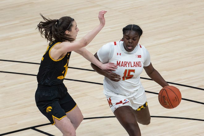 Mar 13, 2021; Indianapolis, IN, USA;  Maryland Terrapins guard Ashley Owusu (15) dribbles the ball while Iowa Hawkeyes guard Caitlin Clark (22) defends in the first quarter at Bankers Life Fieldhouse. Mandatory Credit: Trevor Ruszkowski-USA TODAY Sports