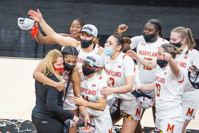 Mar 13, 2021; Indianapolis, IN, USA; Maryland Terrapins players console head coach Brenda Frese after the game against the Iowa Hawkeyes at Bankers Life Fieldhouse. Mandatory Credit: Trevor Ruszkowski-USA TODAY Sports