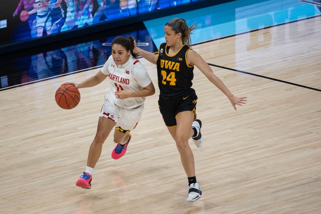 Mar 13, 2021; Indianapolis, IN, USA;  Maryland Terrapins guard Katie Benzan (11) dribbles the ball while Iowa Hawkeyes guard Gabbie Marshall (24) in the second quarter at Bankers Life Fieldhouse. Mandatory Credit: Trevor Ruszkowski-USA TODAY Sports