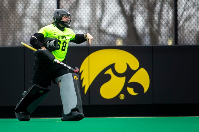 Iowa goalkeeper Grace McGuire (62) reacts after getting a save during a NCAA Big Ten Conference field hockey match against Michigan, Friday, March 12, 2021, at Grant Field in Iowa City, Iowa.