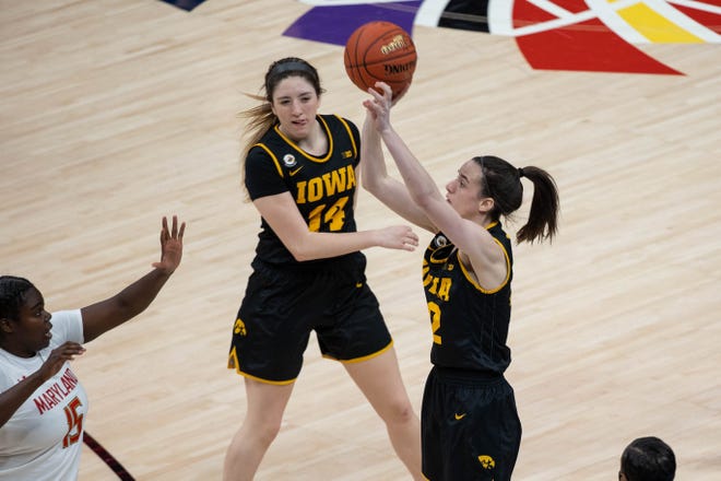 Mar 13, 2021; Indianapolis, IN, USA; Iowa Hawkeyes guard Caitlin Clark (22) shoots the ball while Maryland Terrapins guard Ashley Owusu (15) defends  in the third quarter at Bankers Life Fieldhouse. Mandatory Credit: Trevor Ruszkowski-USA TODAY Sports