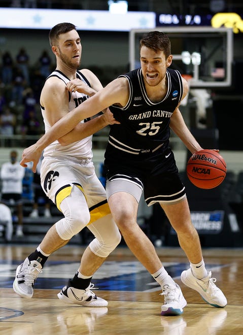 INDIANAPOLIS, INDIANA - MARCH 20: Alessandro Lever #25 of the Grand Canyon Antelopes drives the ball against Connor McCaffery #30 of the Iowa Hawkeyes during the first half in the first round game of the 2021 NCAA Men's Basketball Tournament at Indiana Farmers Coliseum on March 20, 2021 in Indianapolis, Indiana.