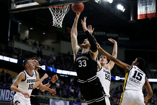 INDIANAPOLIS, INDIANA - MARCH 20: Asbjorn Midtgaard #33 of the Grand Canyon Antelopes drives to the basket as Keegan Murray #15 of the Iowa Hawkeyes defends during the first half in the first round game of the 2021 NCAA Men's Basketball Tournament at Indiana Farmers Coliseum on March 20, 2021 in Indianapolis, Indiana.