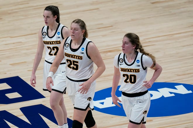 Iowa guard Caitlin Clark (22), forward Monika Czinano (25), and guard Kate Martin (20) during the second half of a college basketball game against Central Michigan in the first round of the women's NCAA tournament at the Alamodome in San Antonio, Sunday, March 21, 2021.