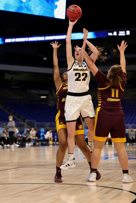 SAN ANTONIO, TEXAS - MARCH 21: Caitlin Clark #22 of the Iowa Hawkeyes puts up a basket ahead of Sophia Karasinski #11 of the Central Michigan Chippewas during the first half in the first round game of the 2021 NCAA Women's Basketball Tournament at the Alamodome on March 21, 2021 in San Antonio, Texas.