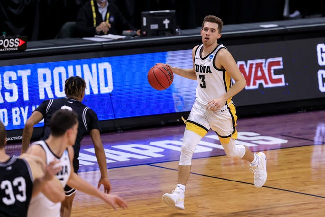 Mar 20, 2021; Indianapolis, IN, USA; Iowa Hawkeyes guard Jordan Bohannon (3) brings the ball up court against the Grand Canyon Antelopes during the first round of the 2021 NCAA Tournament at Indiana Farmers Coliseum.