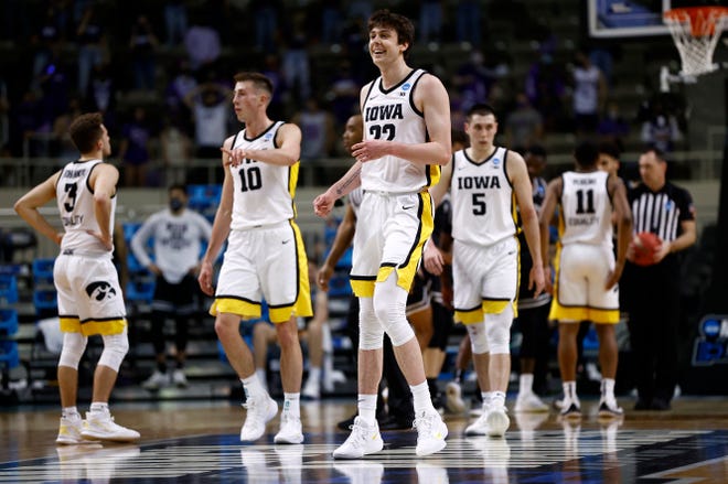 INDIANAPOLIS, INDIANA - MARCH 20: Patrick McCaffery #22 of the Iowa Hawkeyes and Joe Wieskamp #10 of the Iowa Hawkeyes react during the first half against the Grand Canyon Antelopes in the first round game of the 2021 NCAA Men's Basketball Tournament at Indiana Farmers Coliseum on March 20, 2021 in Indianapolis, Indiana. (Photo by Maddie Meyer/Getty Images)