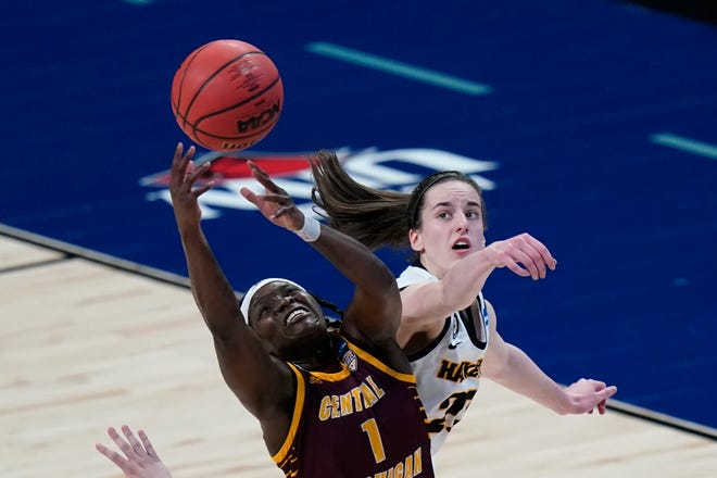 Central Michigan guard Micaela Kelly (1) fights for a rebound with Iowa guard Caitlin Clark, right, during the second half of a college basketball game in the first round of the women's NCAA tournament at the Alamodome, Sunday, March 21, 2021, in San Antonio.