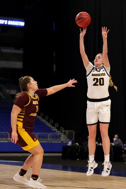 SAN ANTONIO, TEXAS - MARCH 21: Kate Martin #20 of the Iowa Hawkeyes shots during the first half against defender Sophia Karasinski #11 of the Central Michigan Chippewas in the first round game of the 2021 NCAA Women's Basketball Tournament at the Alamodome on March 21, 2021 in San Antonio, Texas. (Photo by Carmen Mandato/Getty Images)