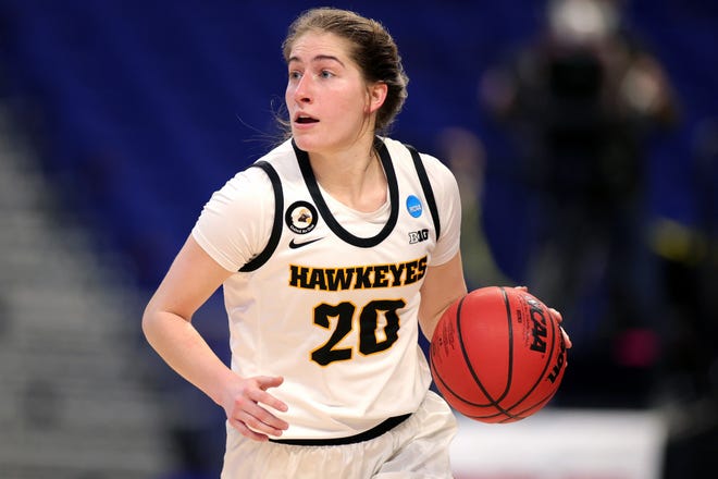 SAN ANTONIO, TEXAS - MARCH 21: Kate Martin #20 of the Iowa Hawkeyes controls the ball during the first half in the first round game of the 2021 NCAA Women's Basketball Tournament at the Alamodome on March 21, 2021 in San Antonio, Texas. (Photo by Carmen Mandato/Getty Images)