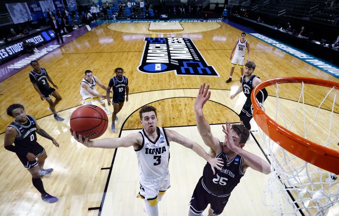 INDIANAPOLIS, INDIANA - MARCH 20: Jordan Bohannon #3 of the Iowa Hawkeyes drives to the basket as Alessandro Lever #25 of the Grand Canyon Antelopes defends during the second half in the first round game of the 2021 NCAA Men's Basketball Tournament at Indiana Farmers Coliseum on March 20, 2021 in Indianapolis, Indiana.