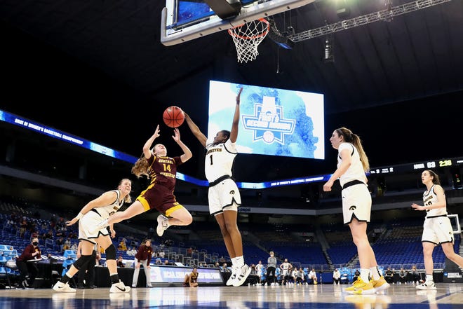 SAN ANTONIO, TEXAS - MARCH 21: Tomi Taiwo #1 of the Iowa Hawkeyes defends against Molly Davis #14 of the Central Michigan Chippewas during the second half in the first round game of the 2021 NCAA Women's Basketball Tournament at the Alamodome on March 21, 2021 in San Antonio, Texas.