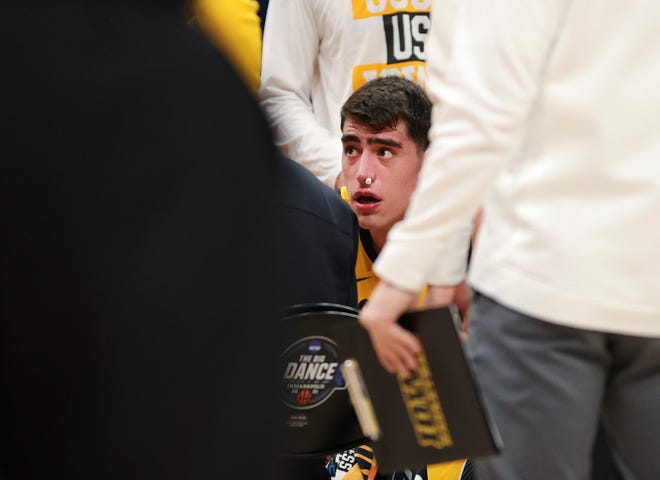 Iowa center Luka Garza looks on during a time out in the second round game of the 2021 NCAA Men's Basketball Tournament against the Oregon Ducks at Bankers Life Fieldhouse on March 22, 2021 in Indianapolis, Indiana.