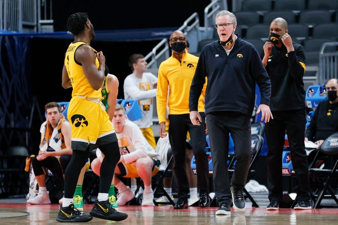 INDIANAPOLIS, INDIANA - MARCH 22: Head coach Fran McCaffery of the Iowa Hawkeyes reacts with Joe Toussaint #1 in the second round game of the 2021 NCAA Men's Basketball Tournament at Bankers Life Fieldhouse on March 22, 2021 in Indianapolis, Indiana.