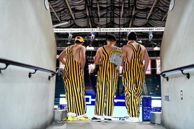 Iowa Hawkeyes fans watch their team warm up before their game against the Oregon Ducks during the second round of the 2021 NCAA Tournament on Monday, March 22, 2021, at Bankers Life Fieldhouse in Indianapolis, Ind.
