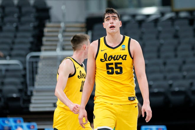 INDIANAPOLIS, INDIANA - MARCH 22: Luka Garza #55 of the Iowa Hawkeyes looks on during the game against the Oregon Ducks in the second round of the 2021 NCAA Men's Basketball Tournament at Bankers Life Fieldhouse on March 22, 2021 in Indianapolis, Indiana.