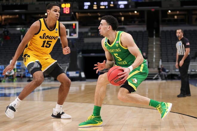 INDIANAPOLIS, INDIANA - MARCH 22: Chris Duarte #5 of the Oregon Ducks handles the ball defended by Keegan Murray #15 of the Iowa Hawkeyes in the second round game of the 2021 NCAA Men's Basketball Tournament at Bankers Life Fieldhouse on March 22, 2021 in Indianapolis, Indiana.