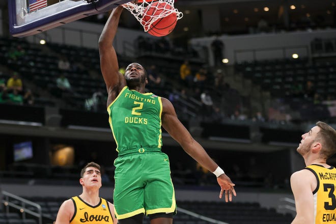 Oregon's Eugene Omoruyi (2) dunks against the Iowa Hawkeyes in the second round game of the 2021 NCAA Men's Basketball Tournament at Bankers Life Fieldhouse on March 22, 2021 in Indianapolis, Indiana.