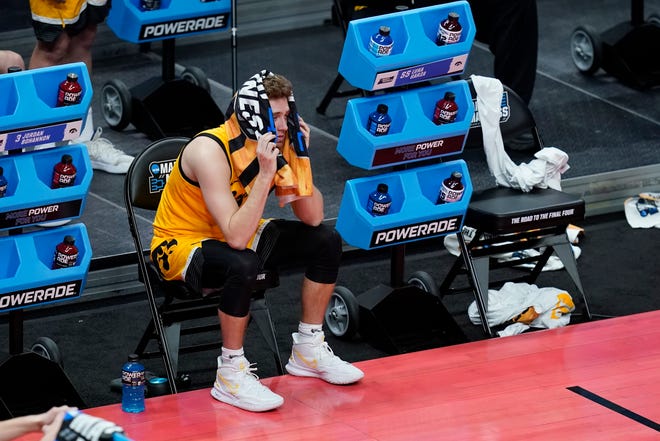 Iowa's Jordan Bohannon watches from the bench during the second half of a second-round game against Oregon in the NCAA men's college basketball tournament at Bankers Life Fieldhouse, Monday, March 22, 2021, in Indianapolis. Oregon won 95-80.