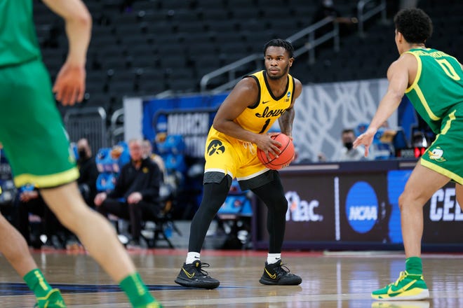 INDIANAPOLIS, INDIANA - MARCH 22: Joe Toussaint #1 of the Iowa Hawkeyes handles the ball against the Oregon Ducks in the second round game of the 2021 NCAA Men's Basketball Tournament at Bankers Life Fieldhouse on March 22, 2021 in Indianapolis, Indiana.