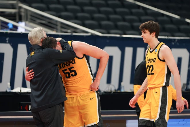 INDIANAPOLIS, INDIANA - MARCH 22: Luka Garza #55 of the Iowa Hawkeyes reacts to losing to the Oregon Ducks with head coach Dana Altman in the second round game of the 2021 NCAA Men's Basketball Tournament at Bankers Life Fieldhouse on March 22, 2021 in Indianapolis, Indiana.