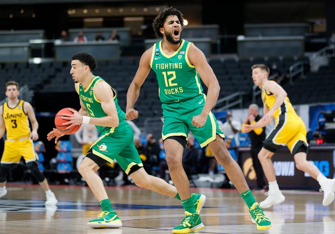 Oregon's LJ Figueroa (12) reacts during the game against the Iowa Hawkeyes in the second round of the 2021 NCAA Men's Basketball Tournament at Bankers Life Fieldhouse on March 22, 2021 in Indianapolis, Indiana.