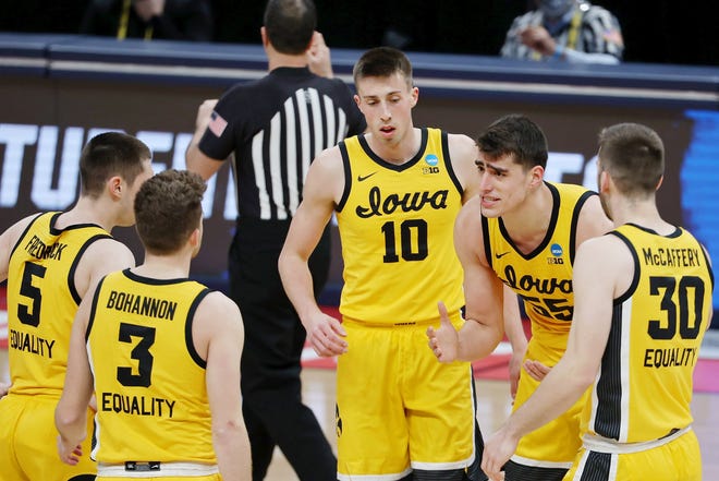 Iowa Hawkeyes center Luka Garza (55) talks with his team after a break in play against the Oregon Ducks during the first half in the second round of the 2021 NCAA Tournament, March 22, 2021, at Bankers Life Fieldhouse.