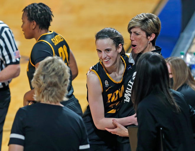 Iowa assistant coach Jan Jensen hugs Iowa guard Caitlin Clark (22) as she comes to the bench during the closing minute of the second half of a college basketball game in the second round of the women's NCAA tournament at the Greehey Arena in San Antonio, Tuesday, March 23, 2021. Iowa defeated Kentucky 86-72.