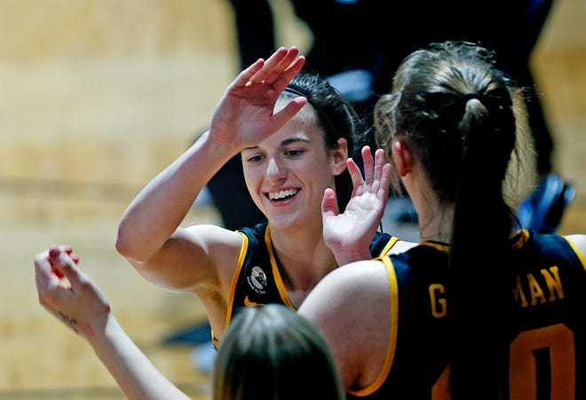 Iowa guard Caitlin Clark is congratulated as she heads to the bench during the second half of the team's college basketball game against Kentucky in the second round of the NCAA women's tournament at Greehey Arena in San Antonio, Tuesday, March 23, 2021. Iowa defeated Kentucky 86-72.
