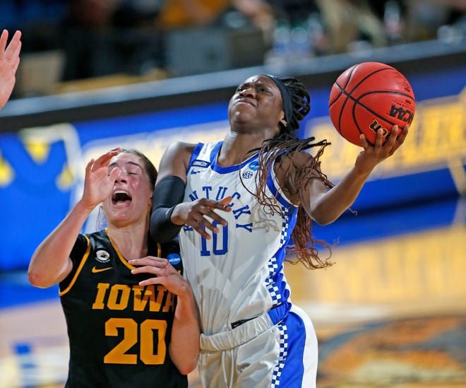 Kentucky guard Rhyne Howard (10) drives past Iowa guard Kate Martin (20) during the second half of a college basketball game in the second round of the women's NCAA tournament at the Greehey Arena in San Antonio, Texas, Tuesday, March 23, 2021. Iowa defeated Kentucky 86-72.