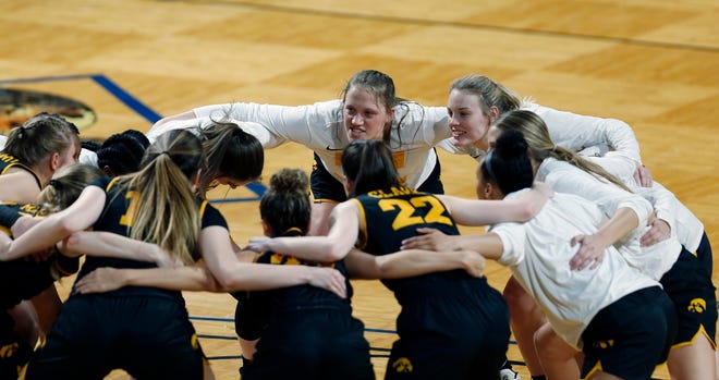 Iowa players cheer before the start of the first half of a college basketball game in the second round of the women's NCAA tournament at the Greehey Arena in San Antonio, Texas, Tuesday, March 23, 2021.