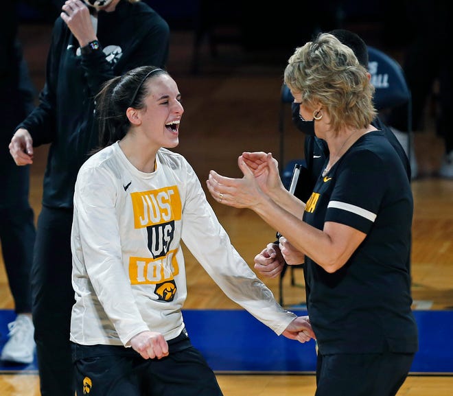 Iowa guard Caitlin Clark, left, celebrates with coach Lisa Bluder at the end of the team's college basketball game against Kentucky in the second round of the NCAA women's tournament, Tuesday, March 23, 2021, at Greehey Arena in San Antonio, Texas. Iowa won 86-72.