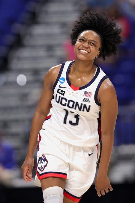 UConn's Christyn Williams (13) reacts to a basket against the Iowa Hawkeyes during the first half in the Sweet 16 round of the NCAA Women's Basketball Tournament at the Alamodome on March 27, 2021 in San Antonio, Texas.